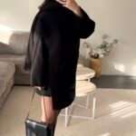 Zwarte jas met sjaal